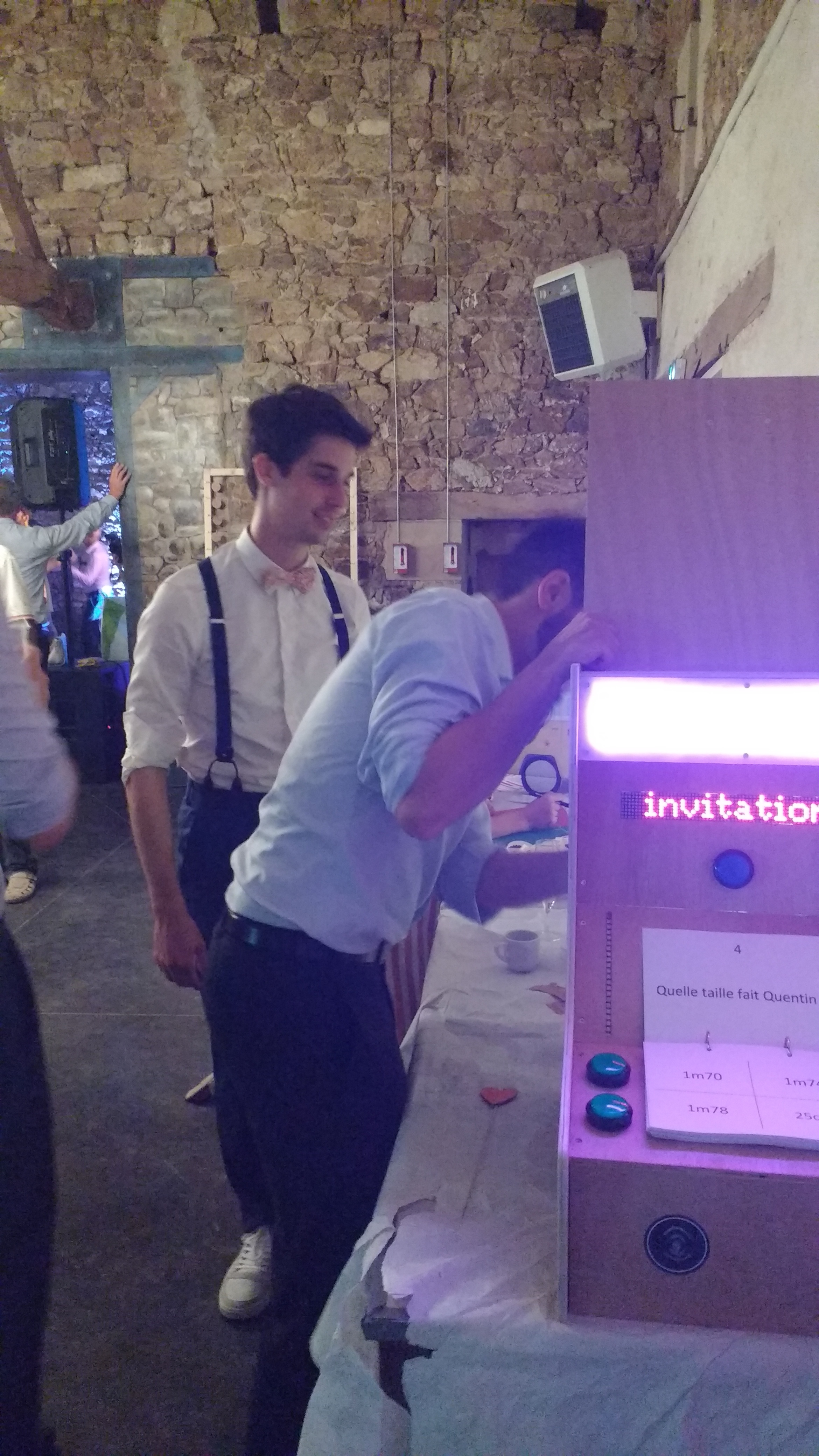 A friend looks inside the machine
